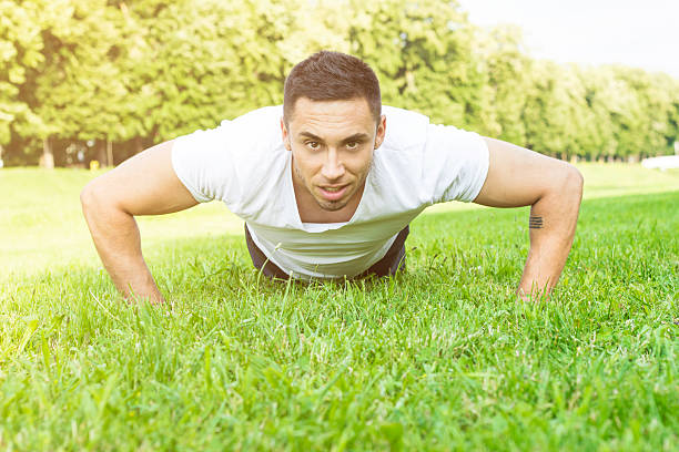 istock Push ups sport fitness man doing push-ups 500521895