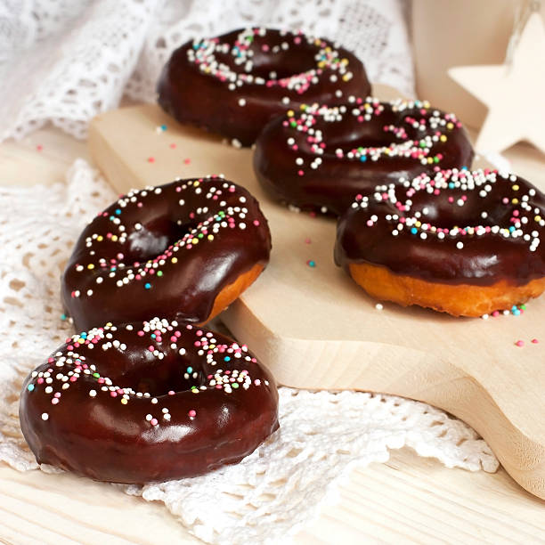 istock chocolate donut on a wooden board 500522811