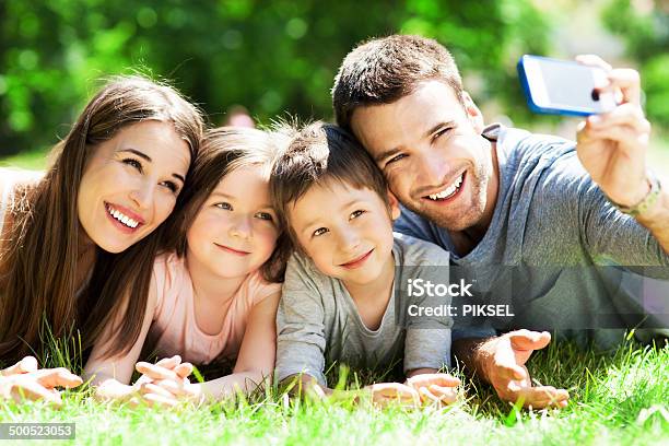 Family Taking Picture Of Themselves Stock Photo - Download Image Now - Adult, Boys, Carefree