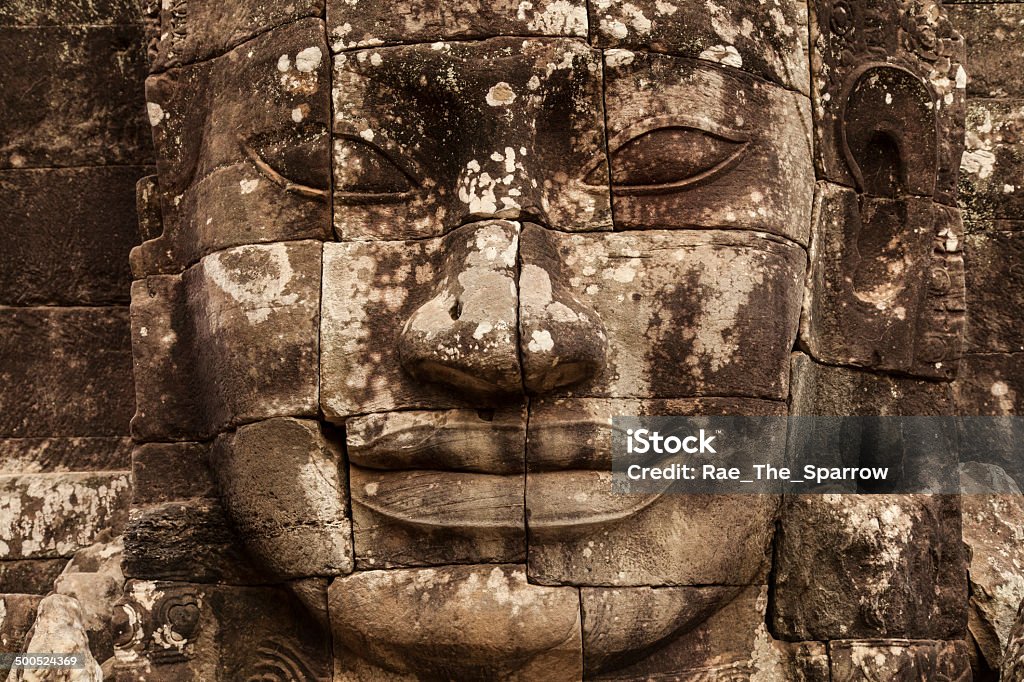Smiling Face of Bayon, Angkor Thom The enigmatic smile of a Bayon face, Angkor Thom, Cambodia Ancient Civilization Stock Photo