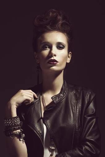 Fashion Rocker Style Model Girl Portrait. Hairstyle. Rocker or Punk Woman Makeup, Hairdo and Accessories
