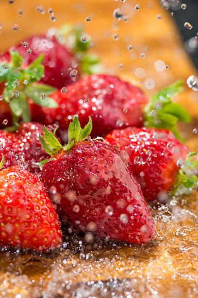 strawberry washed with running water