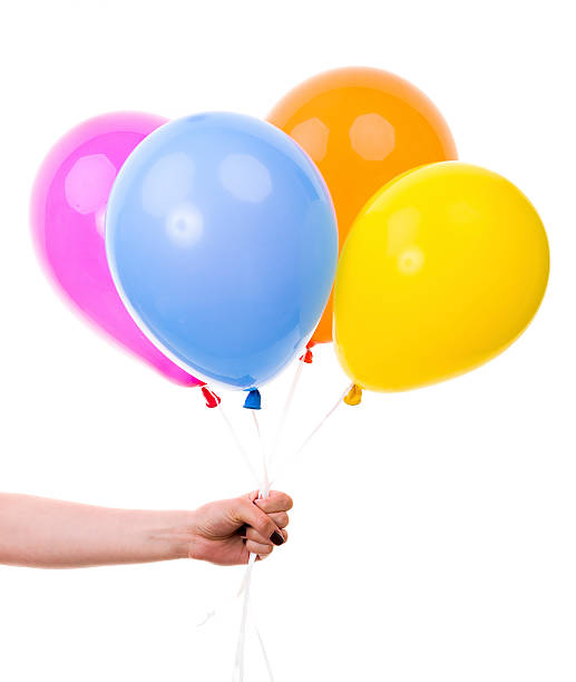istock Colorful Balloons held by Female Hand. On White Background 500527847