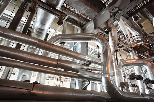 istock different size and shaped pipes and valves 500534034