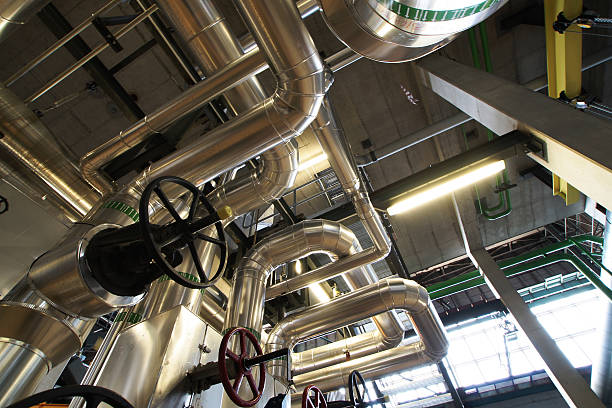 istock different size and shaped pipes and valves 500534472