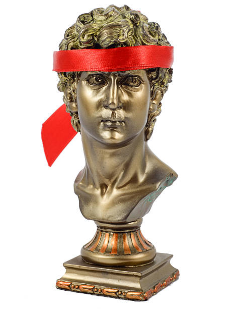 istock Golden Male Statuettes with red scarf 500535211