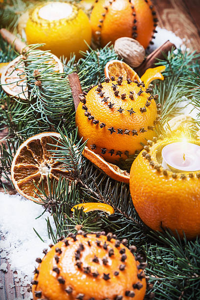 istock dried oranges with nuts and burning candles 500536822