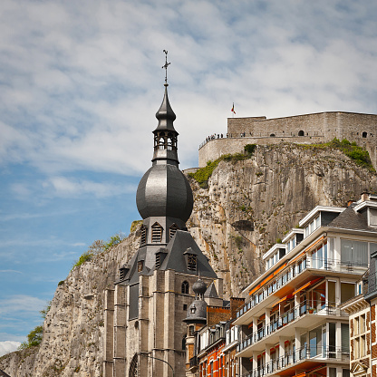 Church in the Belgian City of Dinant against Medieval Fortress, Retro Effect