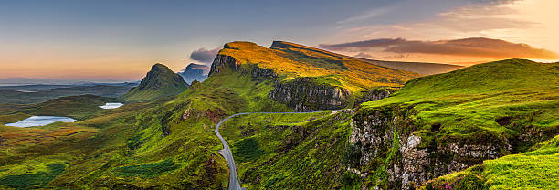 Quiraing mountains sunset at Isle of Skye, Scottland, United Kingdom Panorama of Quiraing mountains sunset at Isle of Skye, Scottish highlands, United Kingdom plateau concept stock pictures, royalty-free photos & images