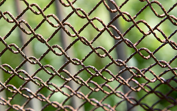 istock Detail of an old rusting chain fence 500540823