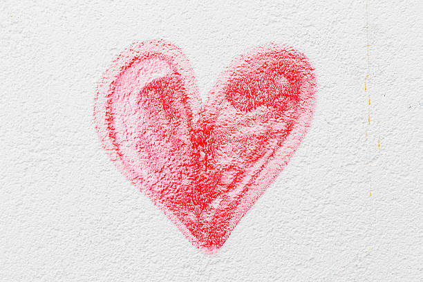 istock Red painted heart on a concrete wall 500540833