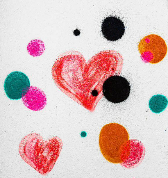 Red painted heart on a concrete wall