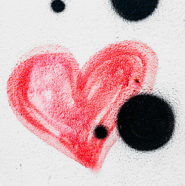 istock Red painted heart on a concrete wall 500540837
