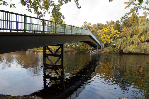 A pedestrian bridge crosses the Charles River in Watertown, MA.