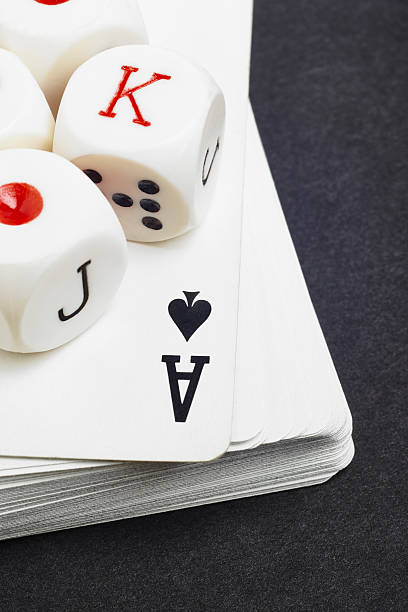 istock Dice and cards poker game over a black background 500541278