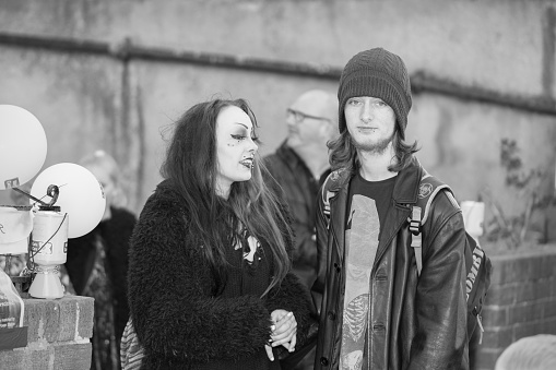 Whitby, England - April 25, 2015: A Young Couple in Gothic Attire at Whitby Goth Weekend. Whitby Goth Weekend is a Twice-Yearly Music Festival for Goths, in Whitby, North Yorkshire, England