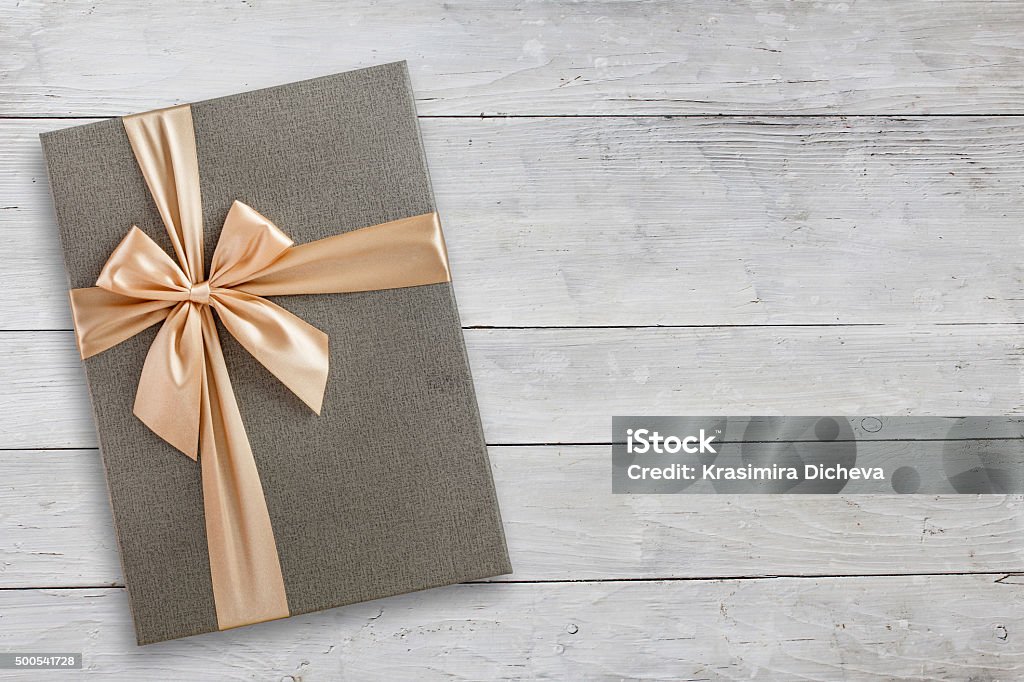 Gift box over white wood Gift box over white wood, top view with copy space, greeting banner Elegance Stock Photo