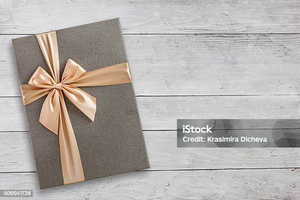 Gift Box Over White Wood Stock Photo - Download Image Now - Elegance, Gift, 2015