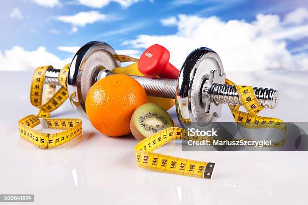 Fitness Dumbbell And Healthy Food Stock Photo - Download Image Now - 2015, Blue, Blue Background