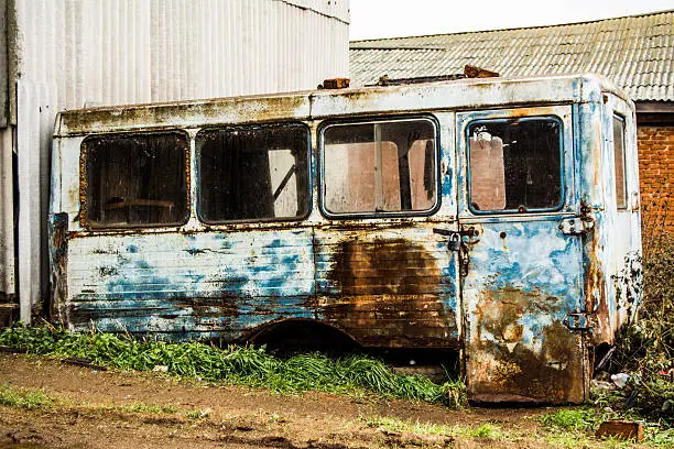 metallic house style grunge, old bus at the dump