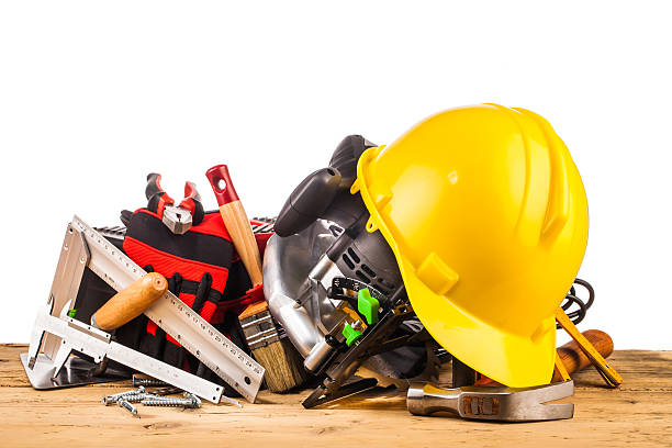 istock yellow helmet and wood mounting tools 500544200