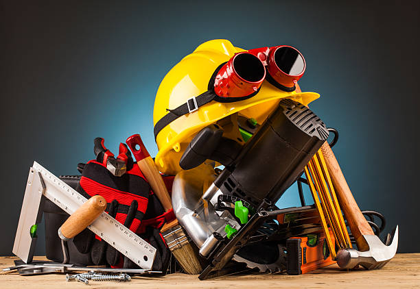 istock yellow helmet and wood mounting tools 500544398