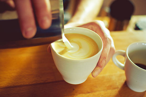 istock Creating latte art with hot frothed milk 500545192