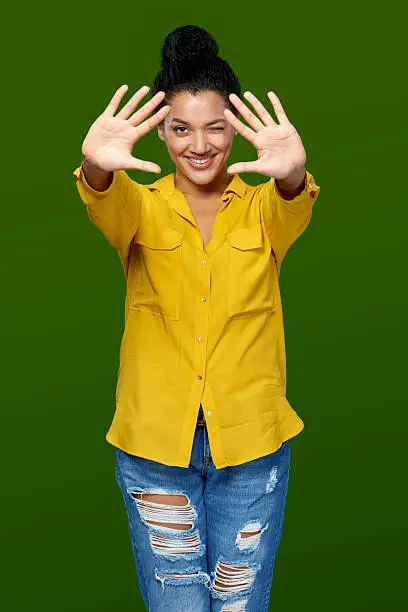 Happy mixed race african american - caucasian woman showing two palms, giving high five gesture - success and winning concept.