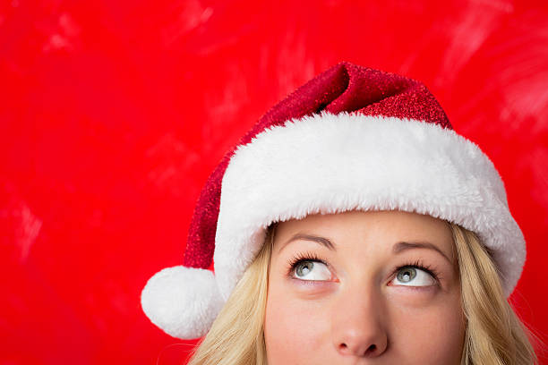 istock Woman looking up at her red hat 500546782