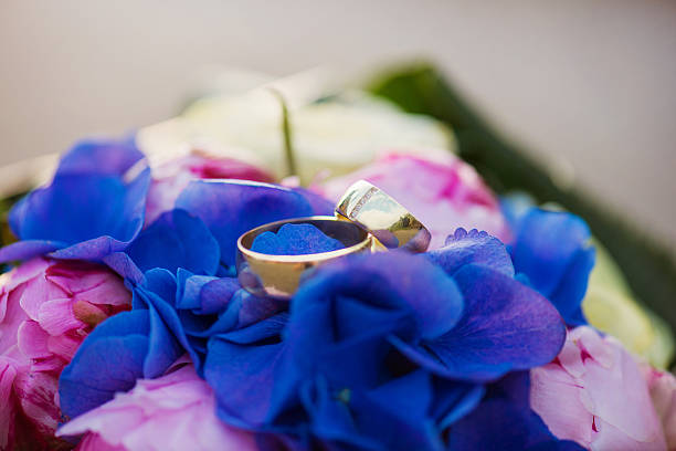 istock Wedding rings and bouquet 500547160