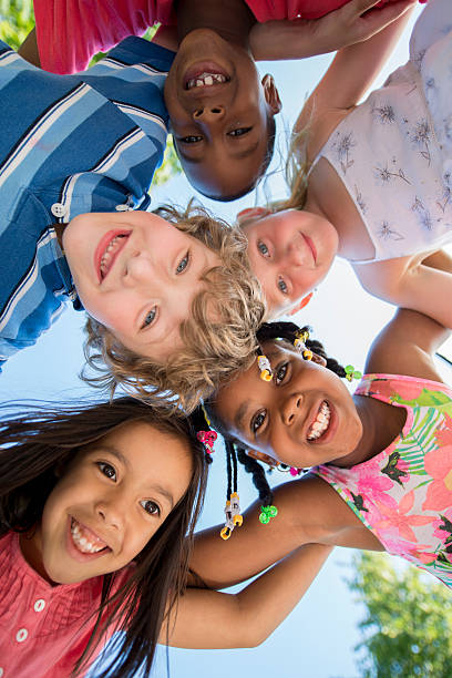 istock Children in a Huddle at the Park 500549238