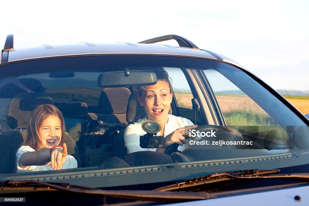 Girl with mother in car driving 40-44 Years Stock Photo