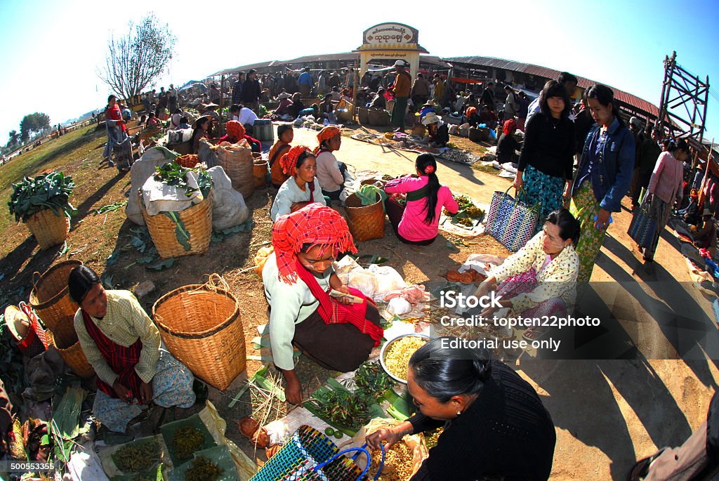 Traditional market at Inle lake. Inle,Myanmar-February 1,2014  : Myanmar woman sell vegetables in Morning traditional market every day on February 1,2014 in Inle , Myanmar. Adult Stock Photo