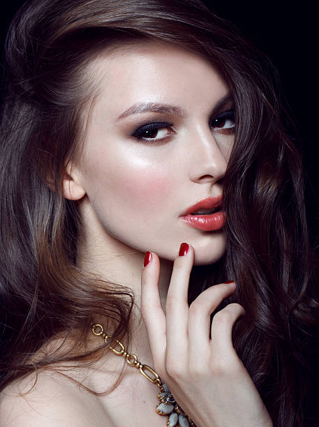 istock Beautiful young model with red lips and red manicure 500553751