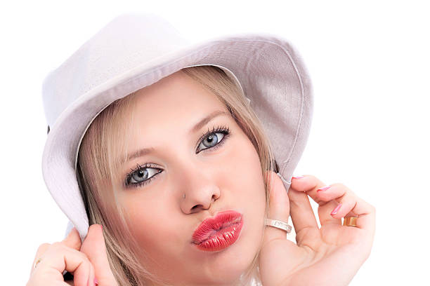 Beautiful Young woman with hat and big kiss