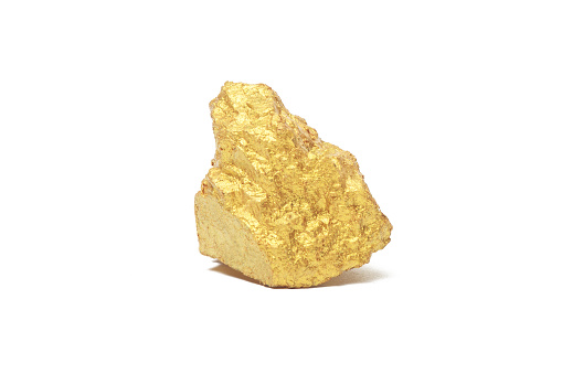 Closeup of big gold nugget isolated on white background