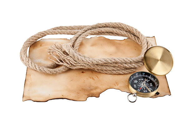 istock Rope and compass on the old paper background 500564414