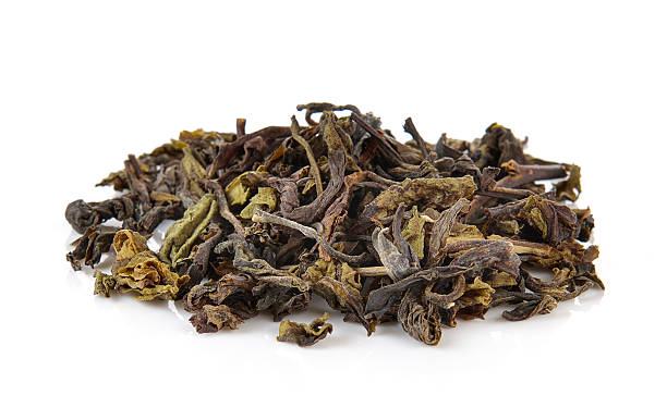 istock Heap of dry green tea isolated on white background 500564792