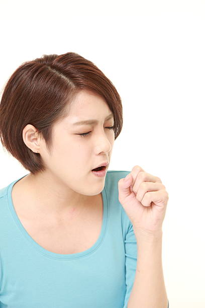 istock young Japanese woman coughing 500565714