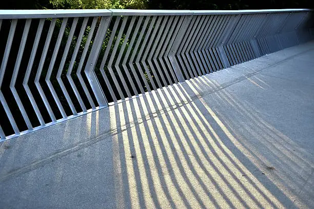Shadow play on a bridge railing in Prague