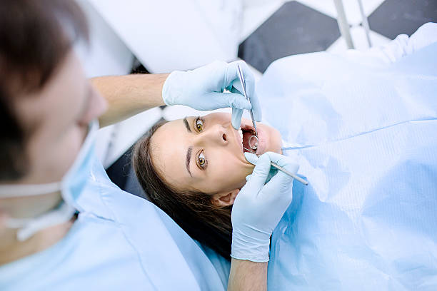 istock Young Woman At The Dentist 500573498