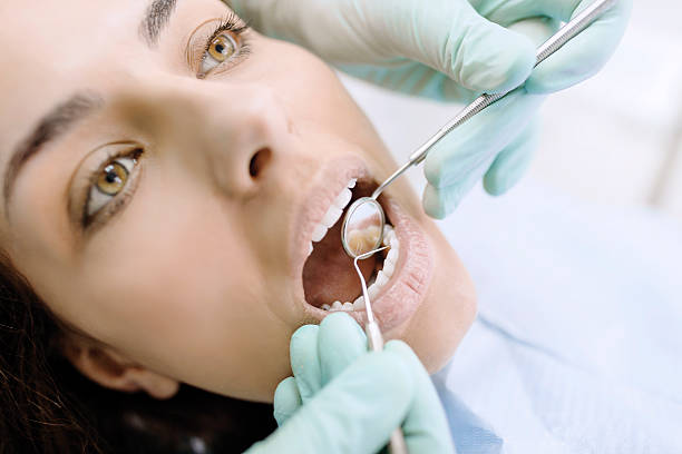 istock Young Woman At The Dentist 500573816