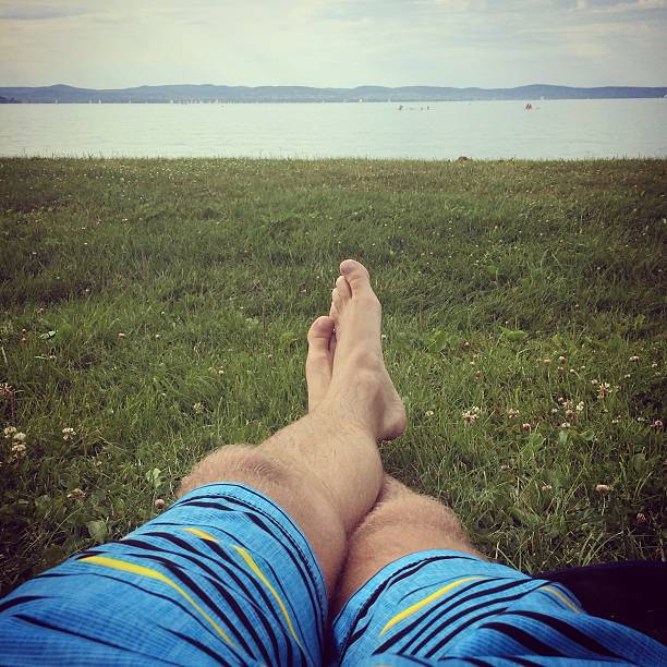istock Men's feet in the grass 500573885