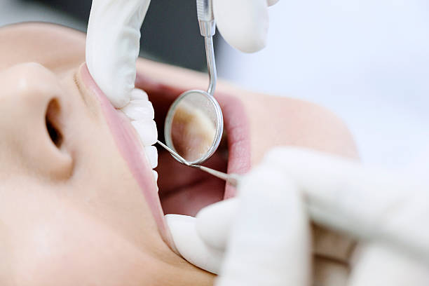 istock Young Woman At The Dentist 500574918