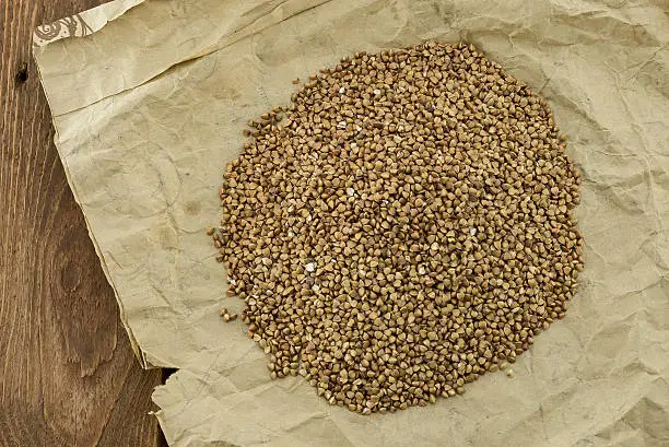 The ripe buckwheat seeds on the wrapping-paper