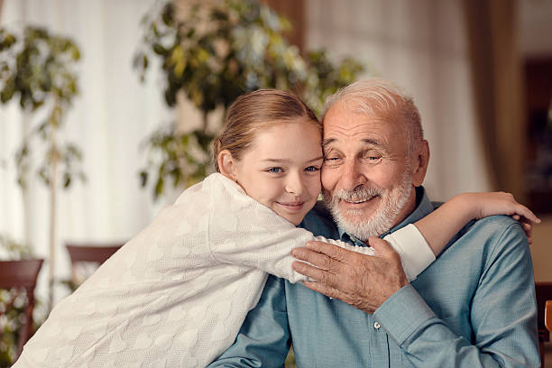 istock Young girl and grandfather 500576222
