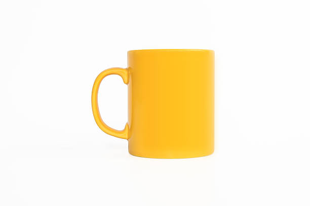 realistico classico tazza gialla - isolated on yellow foto e immagini stock