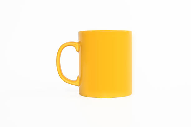 realista clássico amarelo caneca - isolated on yellow imagens e fotografias de stock