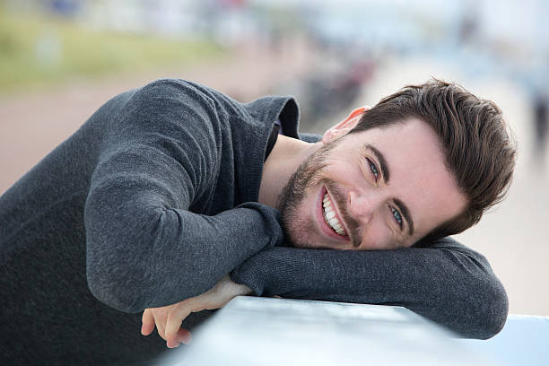 istock Handsome young man relaxing outdoors 500577279