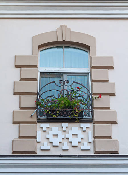 istock Window in a classic style and a box of flowers. Architecture 500577400